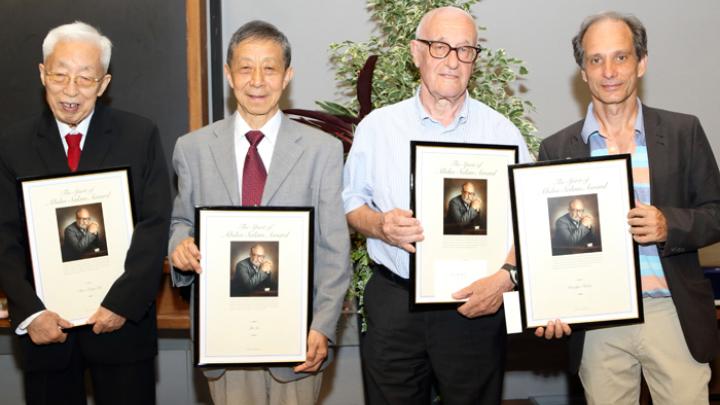 Spirit of Abdus Salam Award recipients (from left) Chao Zeng Zha, Yu Lu, Luciano Bertocchi and Marco Furlan (accepting the award on his father's behalf)